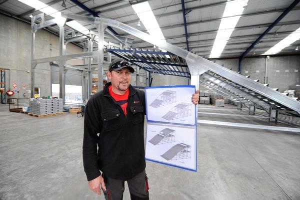 Event Operations Manager Tony Takarua with finished plans of the ramp.